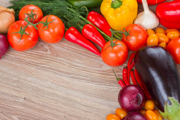 border of fresh vegetables on table