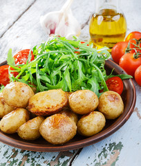 young whole baked potato  arugula