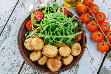 young whole baked potato  arugula