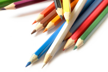 Fototapeta premium Multicolored pencils close-up on white background