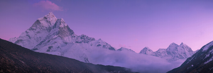 Ama Dablam peak and purple sunset in Himalayas