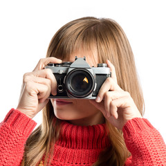 Girl taking a picture over white background
