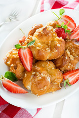 Profiteroles with nuts and strawberries
