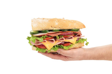 Big fresh sandwich in hands.