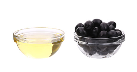 Sunflower oil and olives in glass bowl.