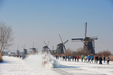 skaters near the mills of Kinderdijk