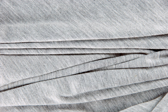 Folded gray cotton polyester texture.
