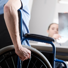 Disabled man at doctors office