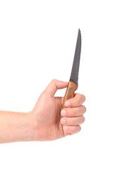 Hand holds knife.