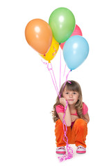 Fototapeta na wymiar Thoughtful little girl with balloons