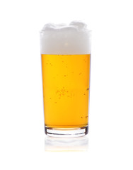 Glass of beer with froth isolated on white