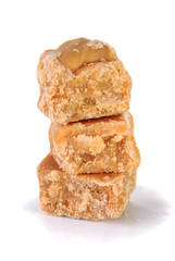 Stack of homemade fudge chunks on a white background