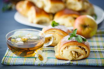 sweet apple muffins with powdered sugar and mint