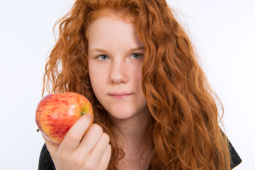 red haired girl with apple