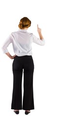 Redhead businesswoman standing and pointing