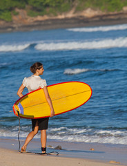 Businesswoman with surf near the ocean