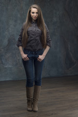 Fototapeta premium Woman standing on dark background