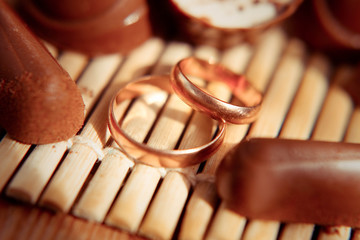 Wedding gold rings on chocolates
