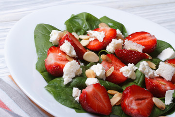 Fresh salad of strawberries, spinach, goat cheese and almond