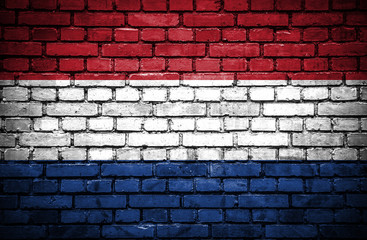 Brick wall with painted flag of Netherlands