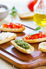 Crostini with Pesto, Cheese,and Tomato