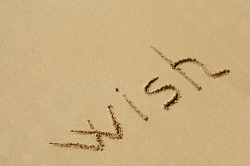 Conceptual text sand on beach