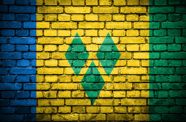 Brick wall with painted flag of Saint Vincent and Grenadines