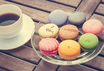 colorful macarons with black coffee