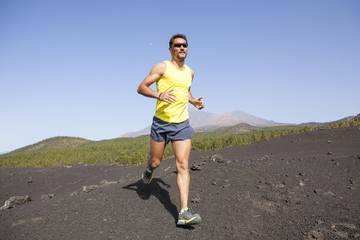 Man running outdoors, cross country trail run