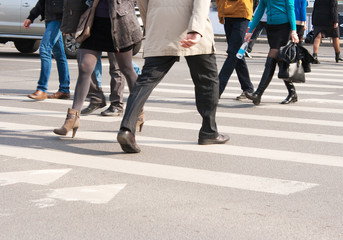 pedestrians cross the street