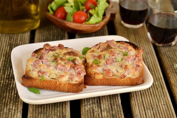 Warm open faced sandwiches with ham, cheese