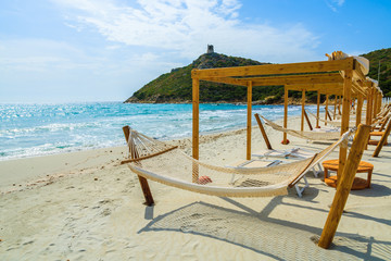 Hammocks and sunchairs on Villasimius beach, Sardinia island