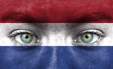 Human face painted with flag of Netherlands