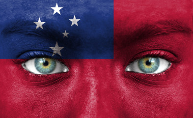 Human face painted with flag of Samoa