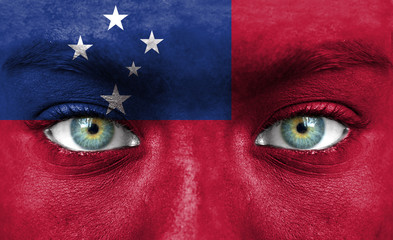 Human face painted with flag of Samoa