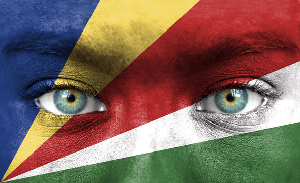 Human face painted with flag of Seychelles