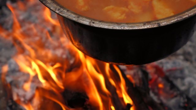 Close up of cooking Hungarian paprika potatoes on a campfire