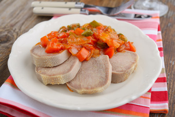 Beef tongue and sauce with gherkins