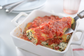 Cannelloni on a cake server