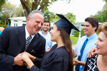 Fototapeta premium Hispanic Student And Family Celebrating Graduation