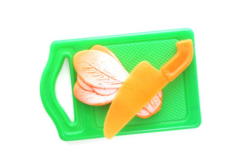 plastic toy  chopping board with vegetable and  knife