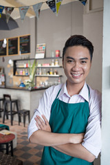 Obraz premium Cheerful cafe owner