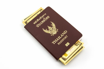 Thailand passport with U.S. Currency bank note.