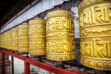 Golden prayer wheels