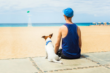 dog and boy at the beach