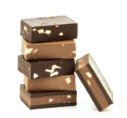 Chocolate pieces isolated on white background.