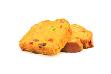 Sliced fruit cake on white background