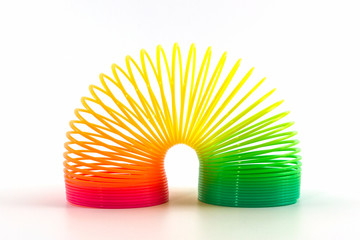Rainbow colored wire spiral toy.