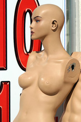 Plastic doll in front of a shop
