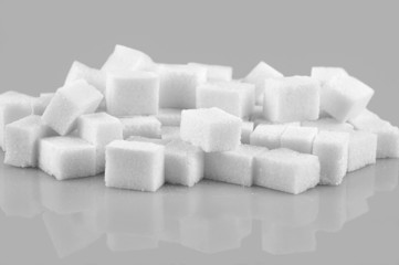 Sugar cubes isolated on gray  background